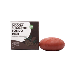 Confezione del doccia shampoo solido al caffè accanto al panetto